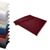 A stack of pillowcases in various colors and a folded duvet cover in bordeaux. Produktbild-Vorschau