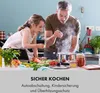 A father and daughter are cooking together in a kitchen, with steam rising from a pot on the stove. Produktbild-Vorschau