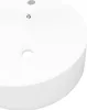 A close-up view of a white ceramic sink with two holes. Náhled obrázku produktu
