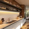 A modern kitchen counter with a sink, faucet, knife block, and a stand mixer. Produktbild-Vorschau