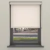 A roller blind is shown covering most of a window, with a view of a street and trees visible through the lower part of the window. Produktbild-Vorschau