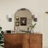 A dresser with a mirror above it, decorated with various items. Podgląd zdjęcia produktu