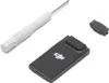 A screwdriver, a black dongle with a DJI logo, and a small black adapter are arranged on a white background. Produktbild-Vorschau