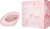 A pink perfume bottle and its pink box packaging are displayed against a white background. Náhled obrázku produktu