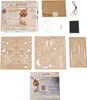 A collection of items for a Harry Potter themed 3D puzzle kit, including the box, unassembled wooden pieces, and instructions. Náhled obrázku produktu