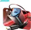 A close-up of a car charger with cables plugged in, set against a blurred red background. Produktbild-Vorschau