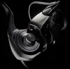 A close-up studio shot of a fishing reel against a black background. Náhled obrázku produktu