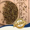 A wooden bowl filled with dried mealworms and soldier fly larvae, scattered on a wooden surface, with a marketing badge overlay. Produktbild-Vorschau