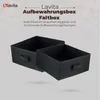 Two black fabric storage boxes are shown, one slightly behind the other, with text and a logo above. Náhľad obrázku produktu