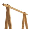 A close-up shot of a wooden garment rack. Produktbild-Vorschau