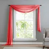 A sheer red scarf draped over a window. Produktbild-Vorschau