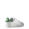 A side view of a white Adidas Stan Smith sneaker with green accents. Náhled obrázku produktu
