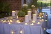 An outdoor table setting with LED candles and string lights. Náhled obrázku produktu