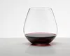 A clear studio shot of a stemless wine glass filled with red wine, placed on a reflective surface against a white background. Produktbild-Vorschau