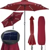 A red patio umbrella with LED lights, a solar panel, and a protective cover, displayed against a white background. Produktbild-Vorschau