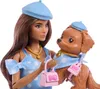 A Barbie doll holding a dog, both wearing matching blue polka-dot outfits and berets. Podgląd zdjęcia produktu