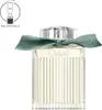 A bottle of Chloé Rose Naturelle Intense Eau De Parfum with a green ribbon tied around the neck. Náhled obrázku produktu