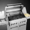 A close-up, angled view of a stainless steel gas grill with its lid open, against a dark background. Produktbild-Vorschau