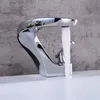 A chrome faucet with water running into a white sink. Podgląd zdjęcia produktu