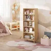 A child's room with a bookshelf, play tent, and rug. Produktbild-Vorschau