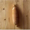 A piece of netting, likely for smoking cheese or ham, hangs against a wooden plank background. Produktbild-Vorschau