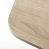 Close-up of a rounded corner of a wooden table. Produktbild-Vorschau