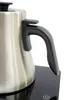 A close-up shot of the handle and part of the body of a stainless steel electric kettle, resting on its black base. Produktbild-Vorschau