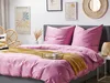 A neatly made bed with pink bedding, a yellow throw blanket, and decorative pillows, set in a bedroom with artwork on the wall. Podgląd zdjęcia produktu