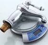 A chrome faucet with a white ceramic handle is placed on a digital scale. Produktbild-Vorschau