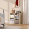 A modern bedroom scene with a storage cube unit next to a bed. Náhľad obrázku produktu