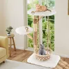 Two cats are playing on a multi-level cat tree in a living room setting, with a window in the background. Náhled obrázku produktu