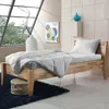 A bedroom scene with a bed, bedding, and decorative items. Produktbild-Vorschau