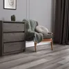 A room setting with a dresser, chair, blanket, and pillow. Podgląd zdjęcia produktu