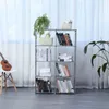 A multi-shelf bookcase filled with books and decorative items, placed in a room with sheer curtains in the background. Produktbild-Vorschau