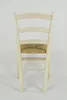 A back view of a wooden chair with a woven straw seat. Produktbild-Vorschau