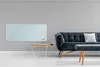 A modern living room with a wall-mounted electric heater, a sofa, and a coffee table. Produktbild-Vorschau