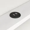 A close-up view of a black USB charging port integrated into a white surface, likely a piece of furniture. Voir les images du produit