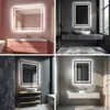 A collage of four different bathroom vanity mirror setups, each featuring a backlit rectangular mirror above a sink and vanity. Produktbild-Vorschau