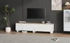 A modern living room with a TV stand, TV, and decorative items. Voir les images du produit