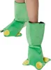 A person's legs wearing green frog costume boot covers. Produktbild-Vorschau
