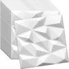 A stack of white 3D wall panels with a geometric design, with one panel placed in front. Produktbild-Vorschau