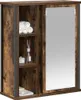 A bathroom cabinet with a mirror and shelves, displaying towels and toiletries. Náhled obrázku produktu
