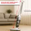 A white and gray stick vacuum cleaner is shown standing on a wooden floor in a living room, with a couch in the background. Voir les images du produit