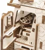 Close-up view of the interior of a wooden model vehicle, showing the steering wheel and dashboard. Podgląd zdjęcia produktu