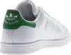 A close-up side view of the heel of a white Adidas Stan Smith sneaker with a green heel tab. Náhled obrázku produktu