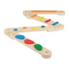 A wooden balance beam toy with colorful stepping stones and bars, arranged in a zig-zag pattern against a white background. Produktbild-Vorschau