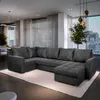 A modern living room with a large sectional sofa. Produktbild-Vorschau