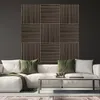 A modern living room with a sectional sofa and a decorative wall panel. Anteprima dell’immagine prodotto