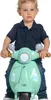 A young child sits on a green toy scooter. Produktbild-Vorschau