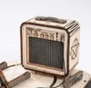A wooden model of an electric guitar amplifier with a pentagram symbol on the side. Voir les images du produit